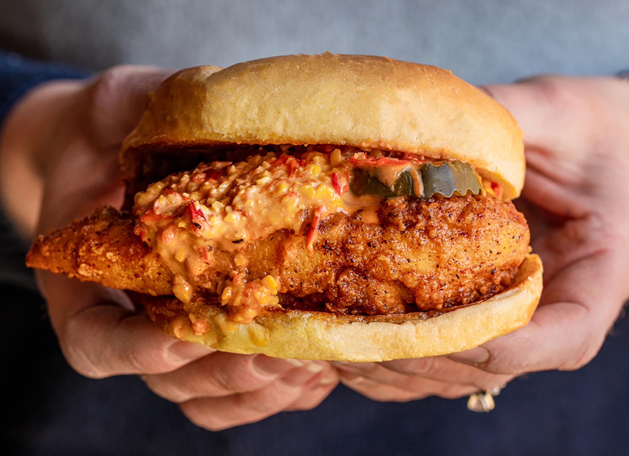 Hands clutching Joella's Big Sammie